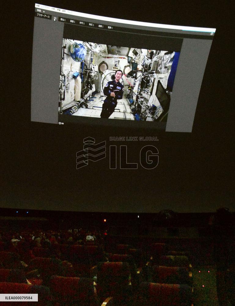 Astronaut communicates with students