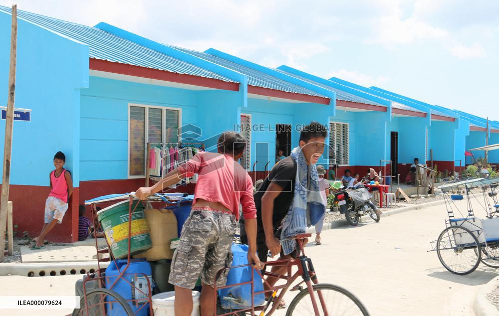 Super typhoon survivors move into permanent homes in Philippines