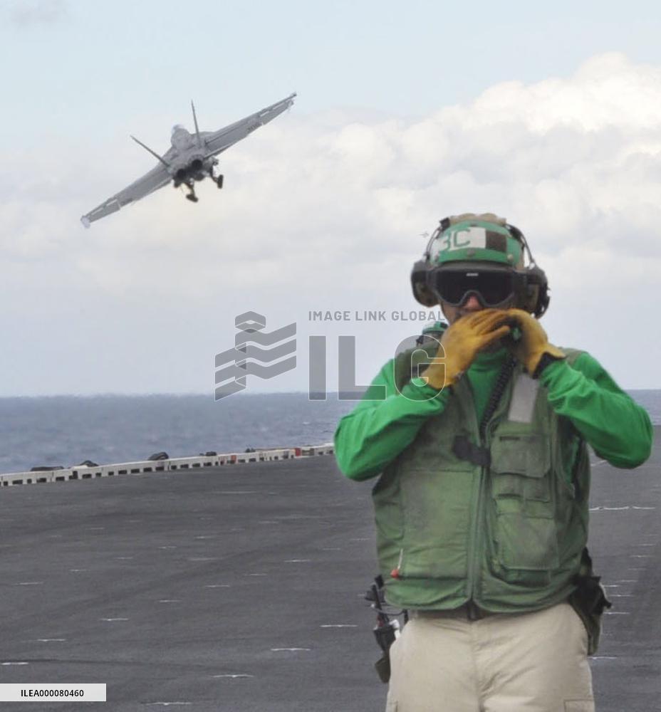 Fighter jet flies off from U.S. flattop in naval drill