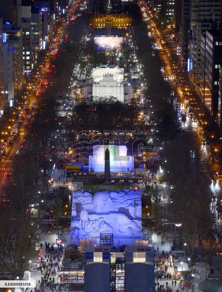 Snow statues lit up prior to start of Sapporo Snow Festival