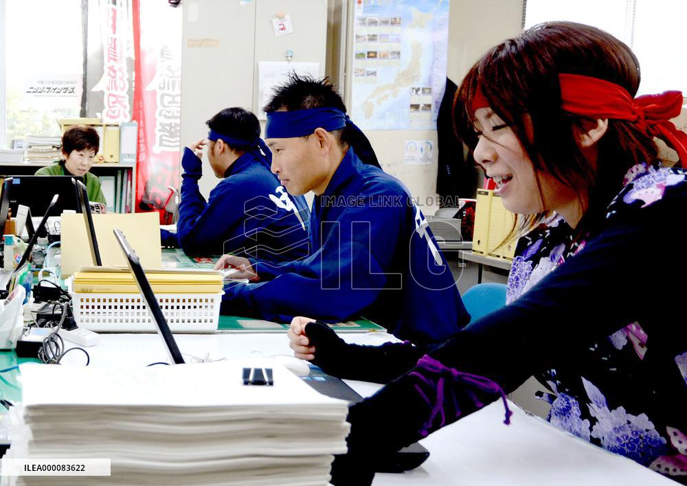 City officials work in ninja costumes