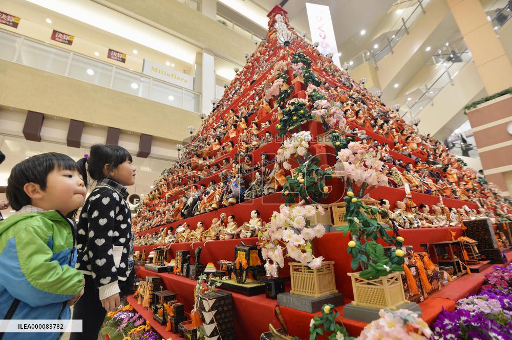 Pyramid decorated with dolls on display