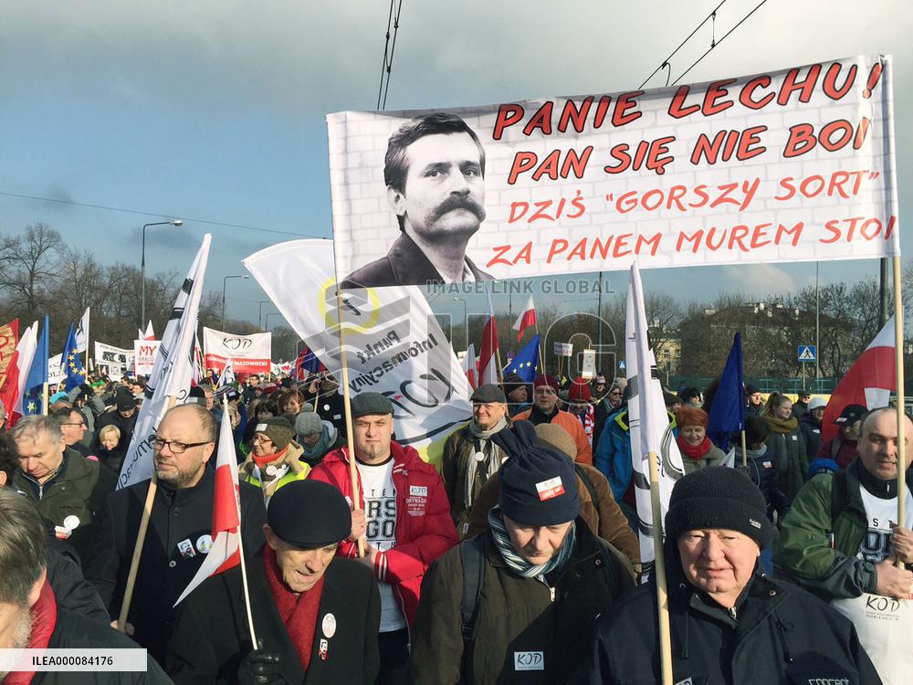 People rally in Warsaw for democracy icon Walesa