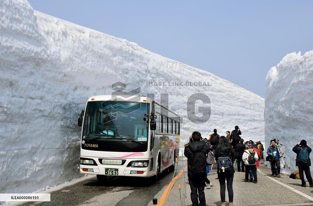 Central Japan's snow-walled mountain road fully reopens
