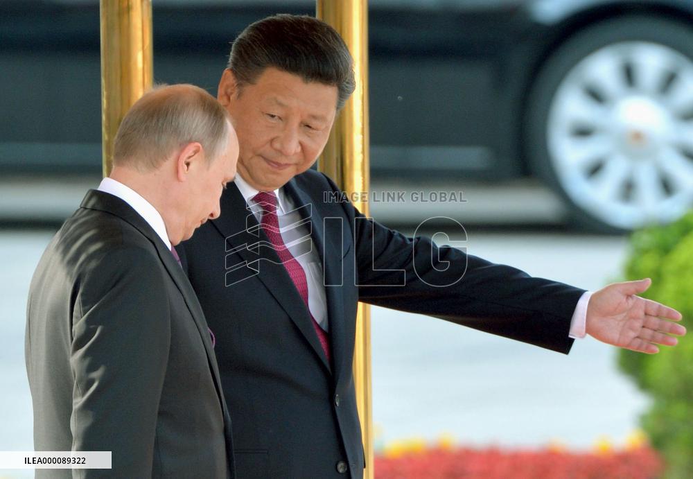 Xi welcomes Putin in Beijing