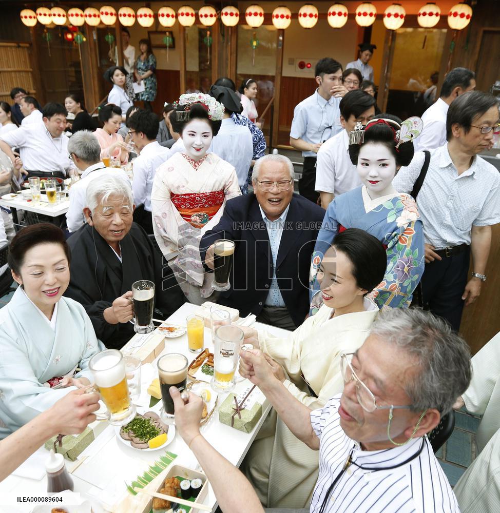 Geisha welcome beer garden customers