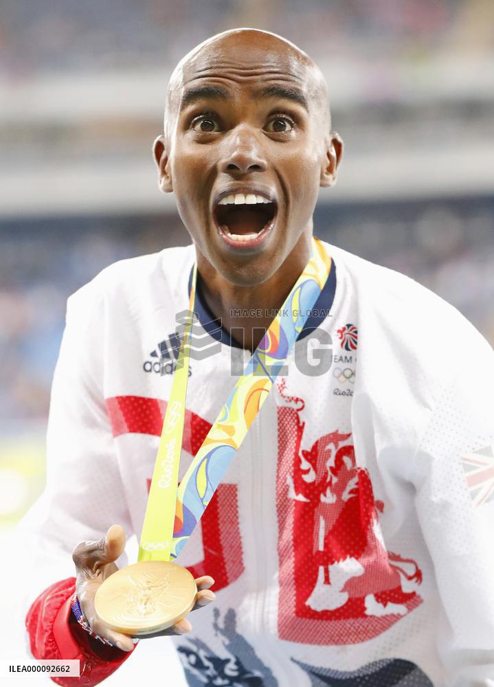 Olympics: Farah wins men's 10,000