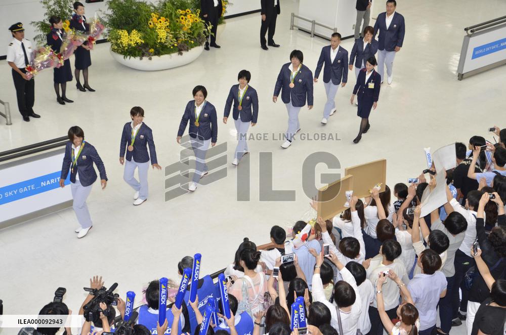 Japan's judo team returns home