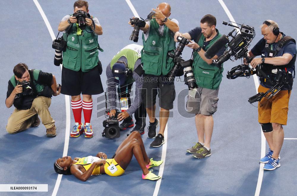 Olympic scenes: Photographers target gold medalist