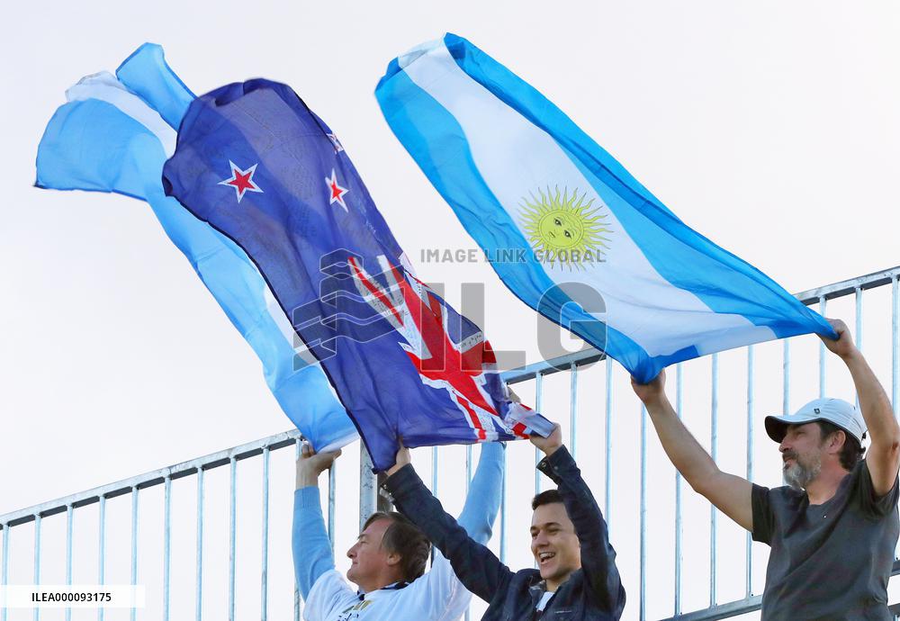 Olympic scenes: Spectators hoist flags