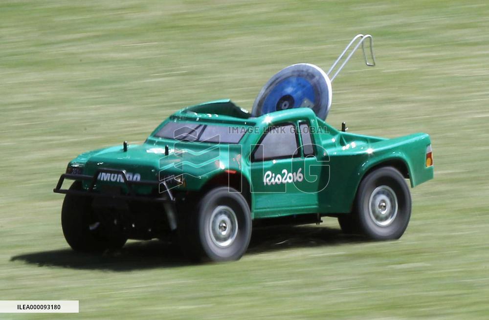 Olympic scenes: Radio-controlled vehicle returns discus