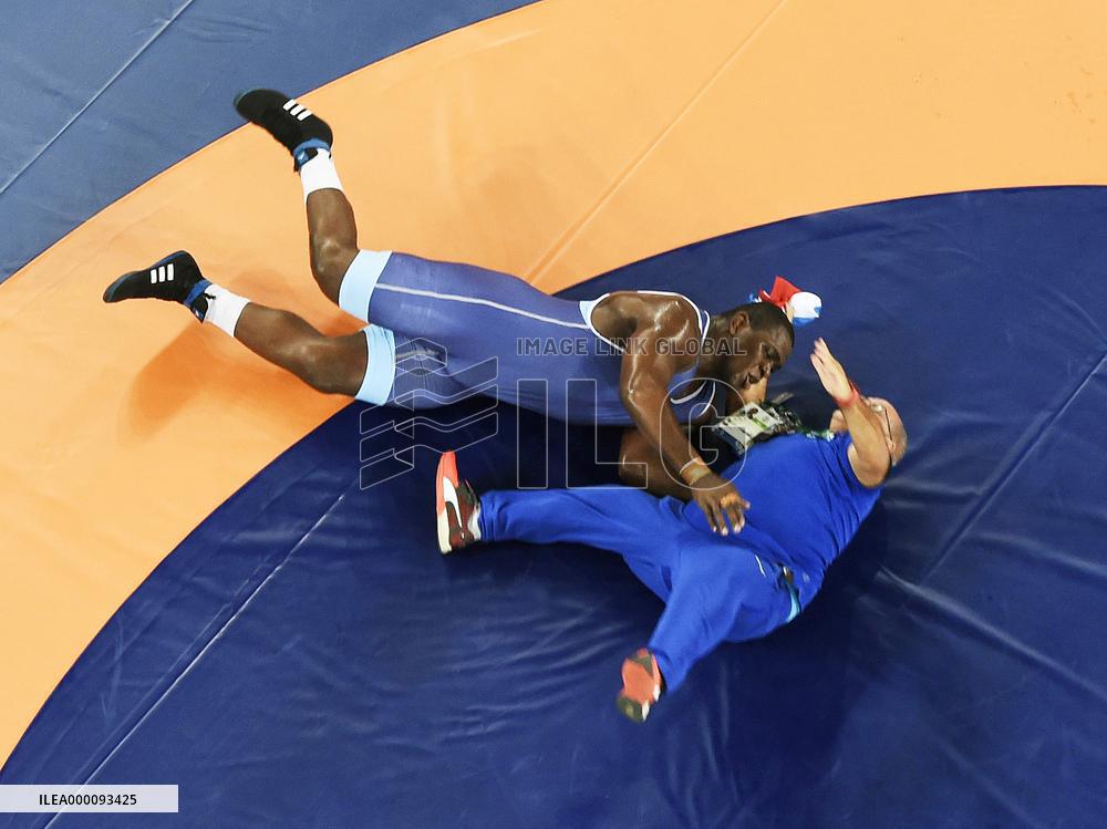 Olympic scenes: Cuban wrestler throws coach