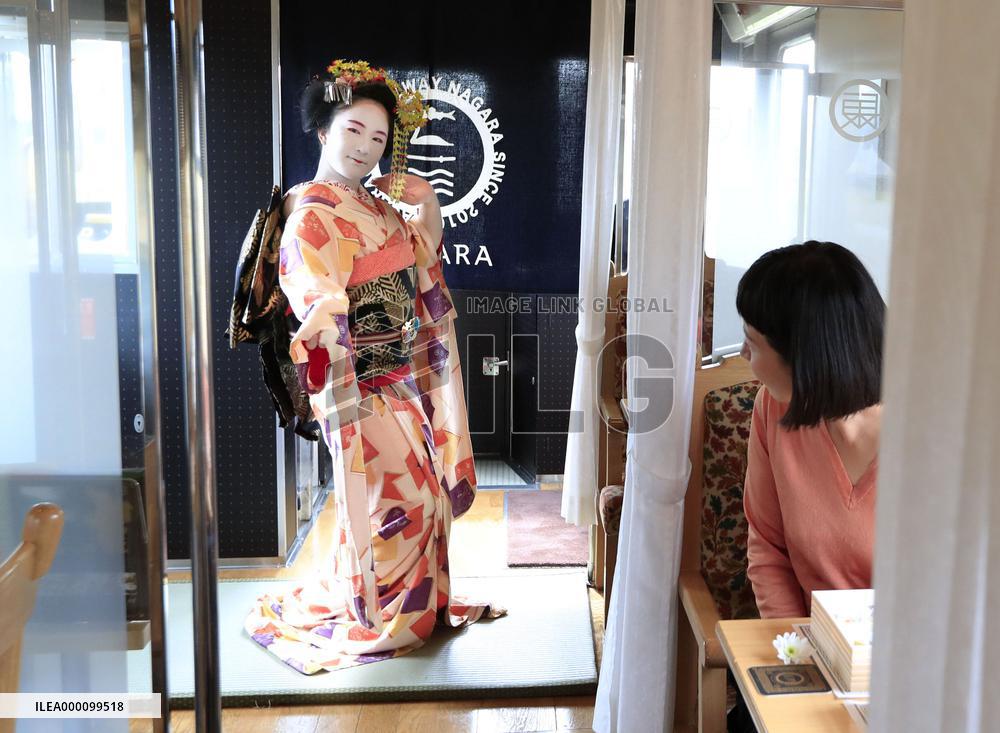Geisha performance in local train car
