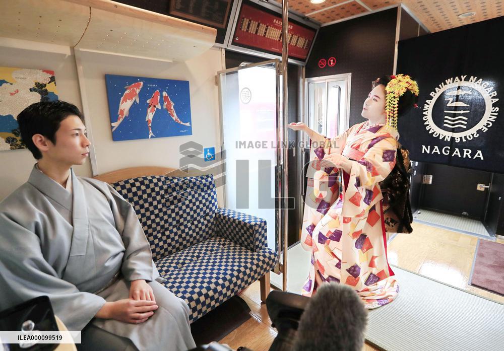 Geisha performance in local train car