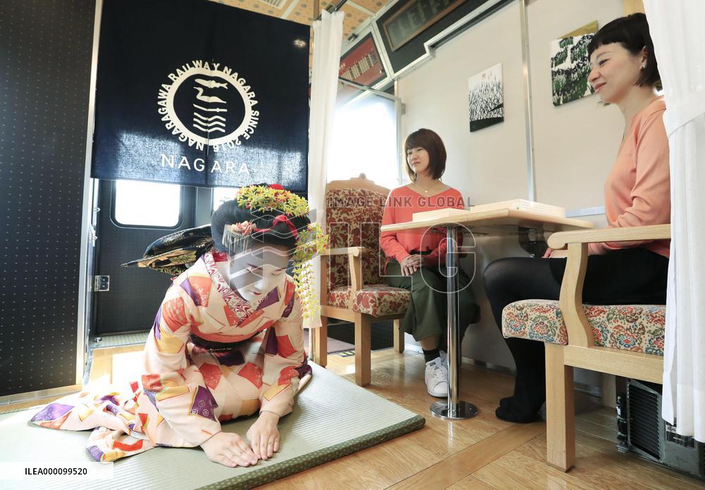 Geisha performance in local train car