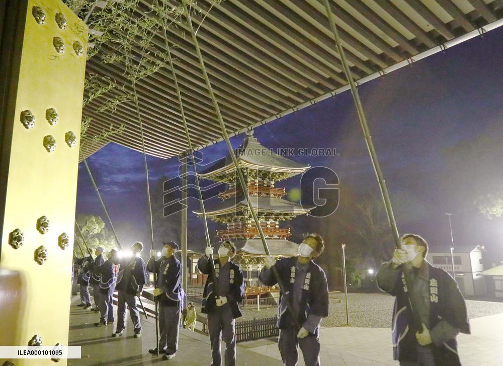 Yearend special cleaning using bamboo at temple