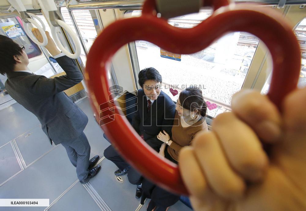 Tokyo railway starts running "love train" with heart-shaped straps