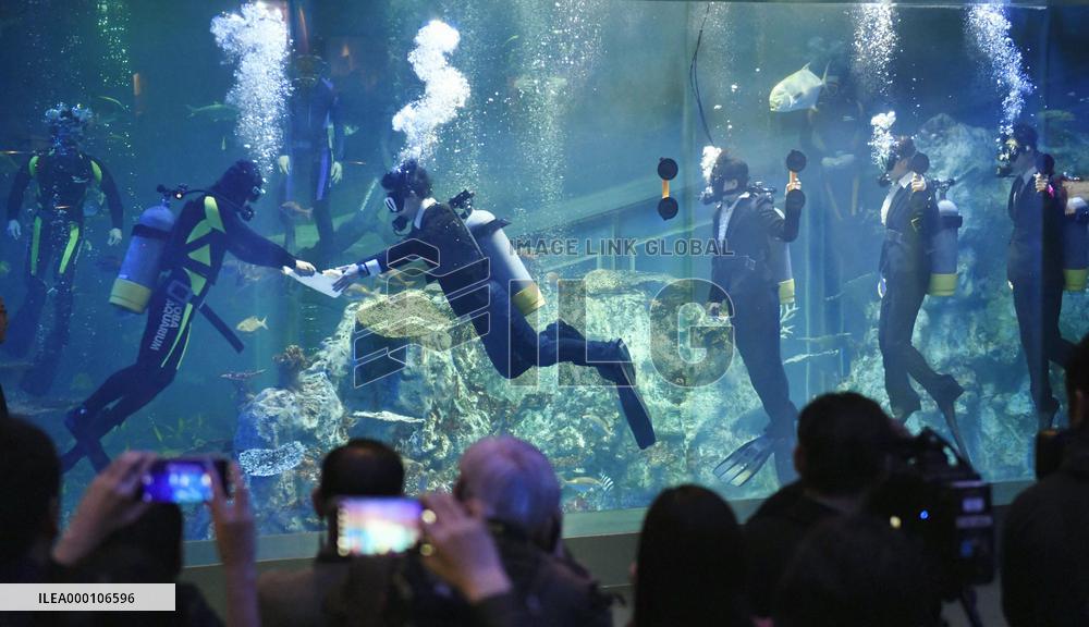 Initiation ceremony for new employees at Japanese aquarium