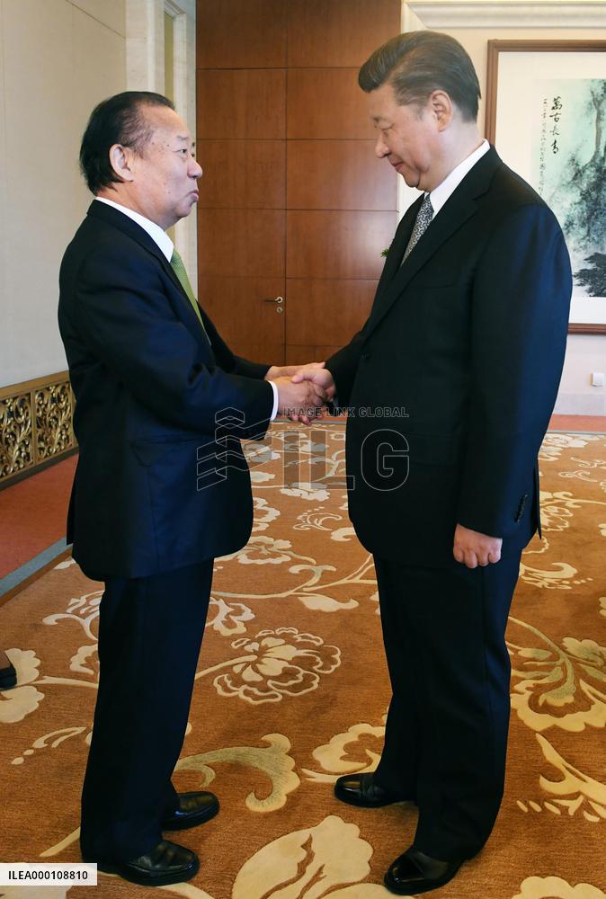 China's Xi meets No. 2 man in Japan's ruling party