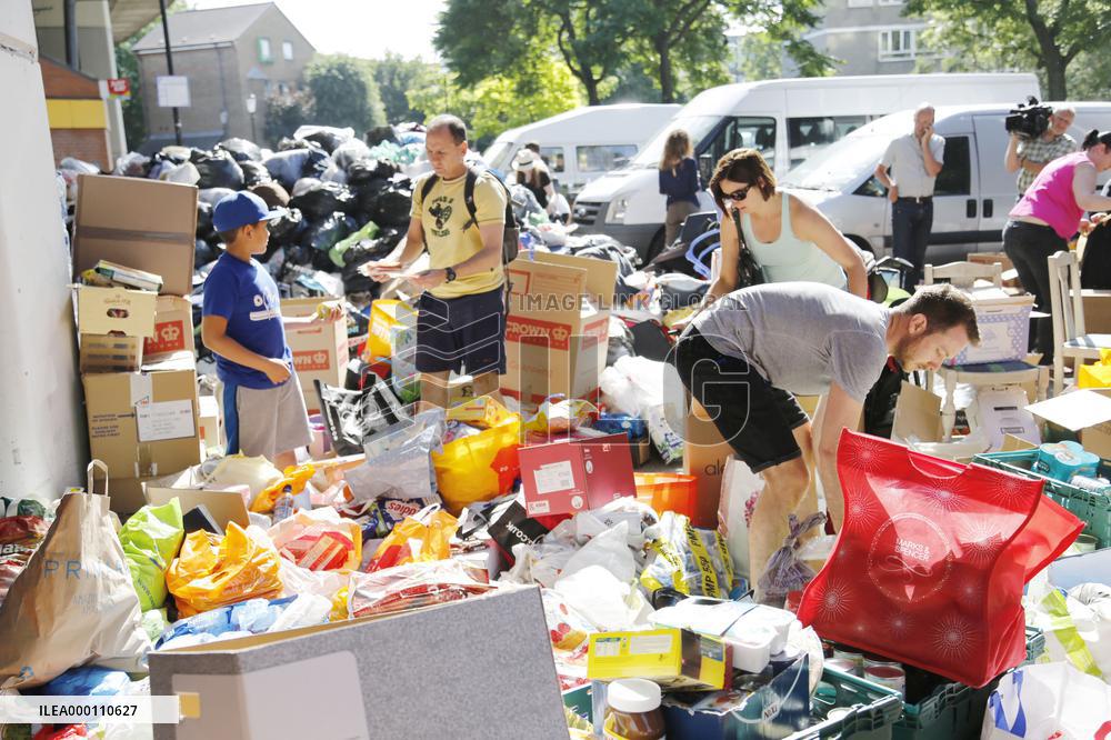 Volunteers provide help to evacuees of London tower block fire
