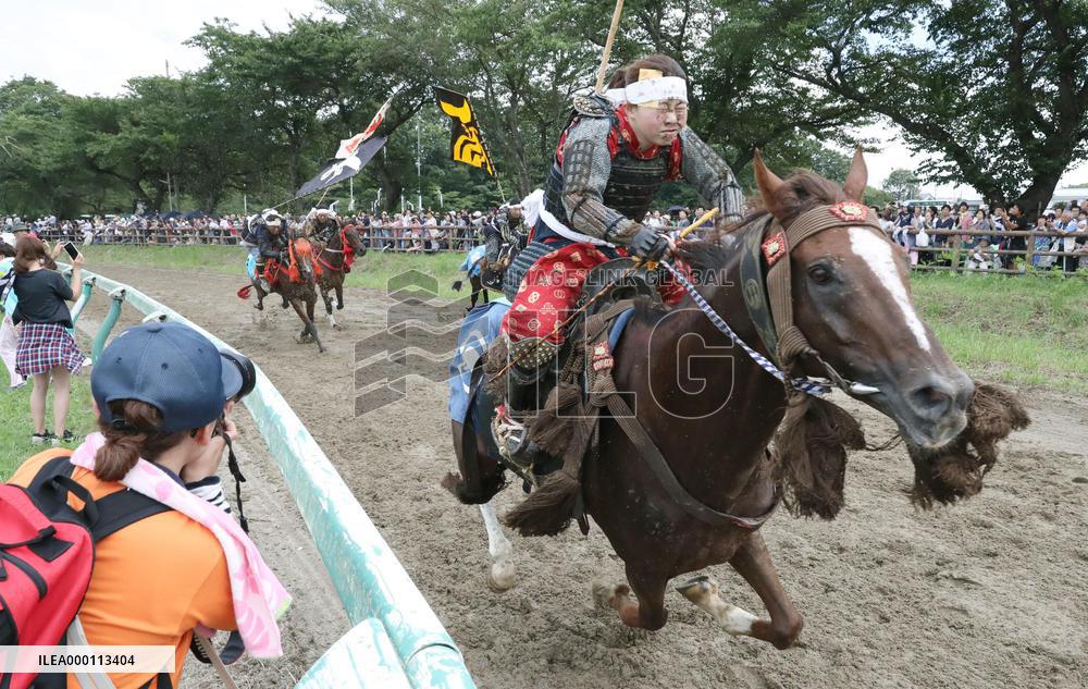 Armored warriors compete in horse race