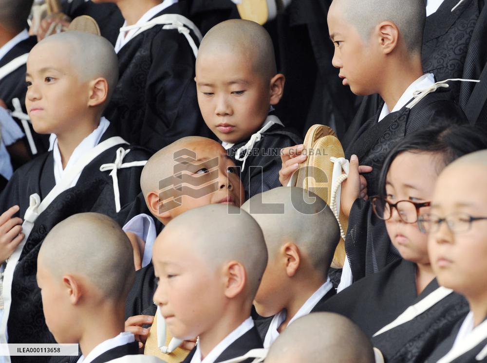 Children become Buddhist priests
