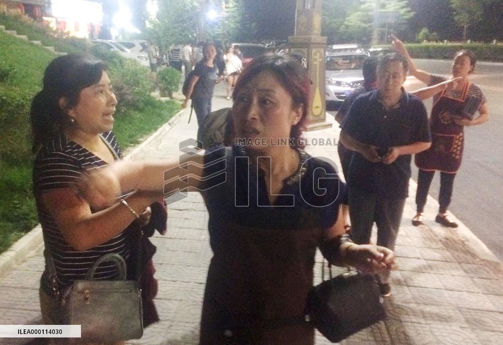 People in quake-hit area in China evacuate on false rumors