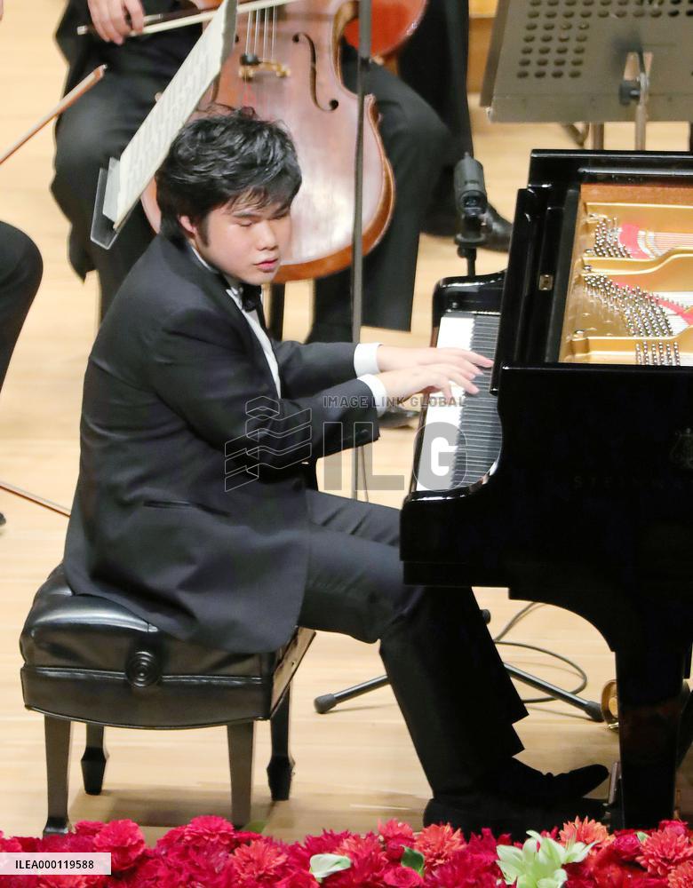 Emperor and empress at piano concert