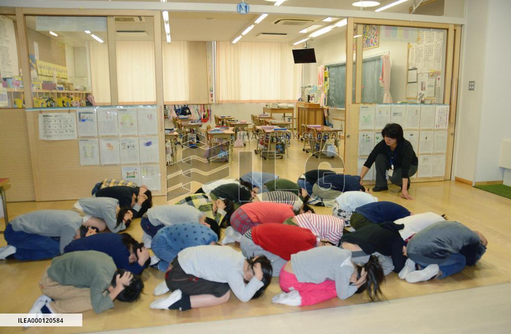 Japanese city conducts missile evacuation drill, faces protest