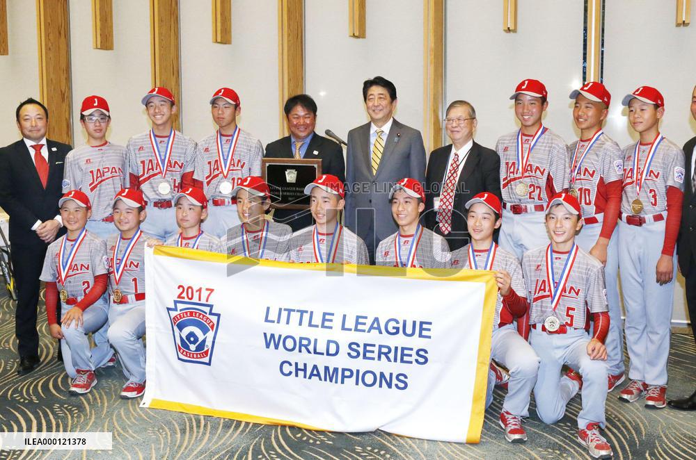 Abe with young baseball players