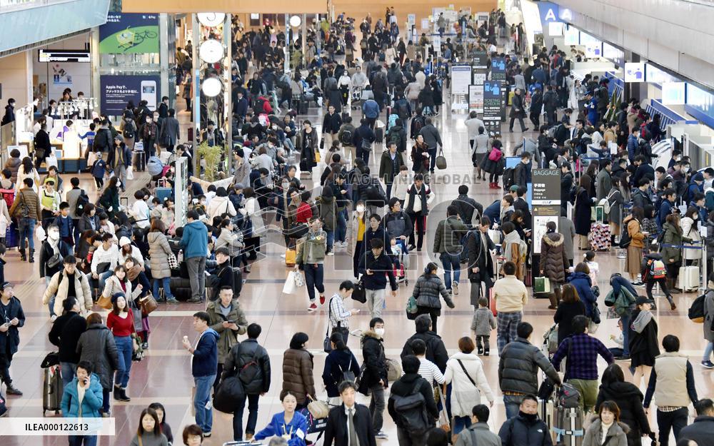 Holidaymakers at Tokyo's Haneda airport