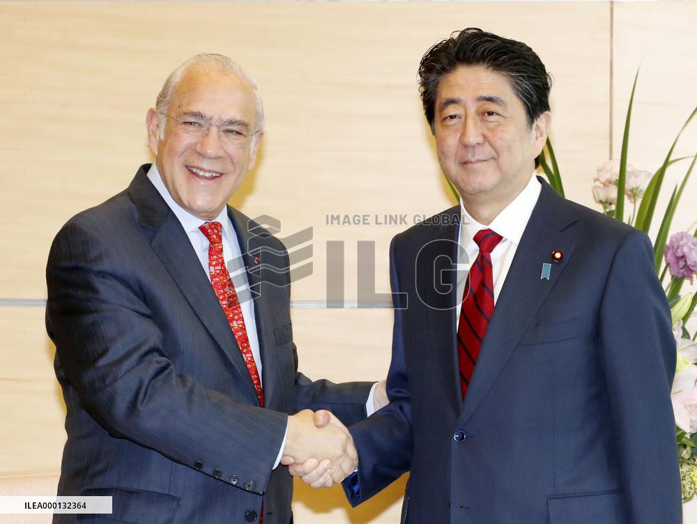 OECD chief and Japan PM Abe