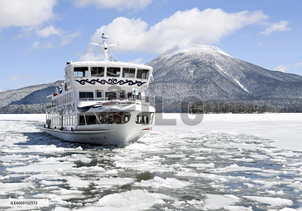 Sightseeing boat breaks ice on Lake Akan in Hokkaido