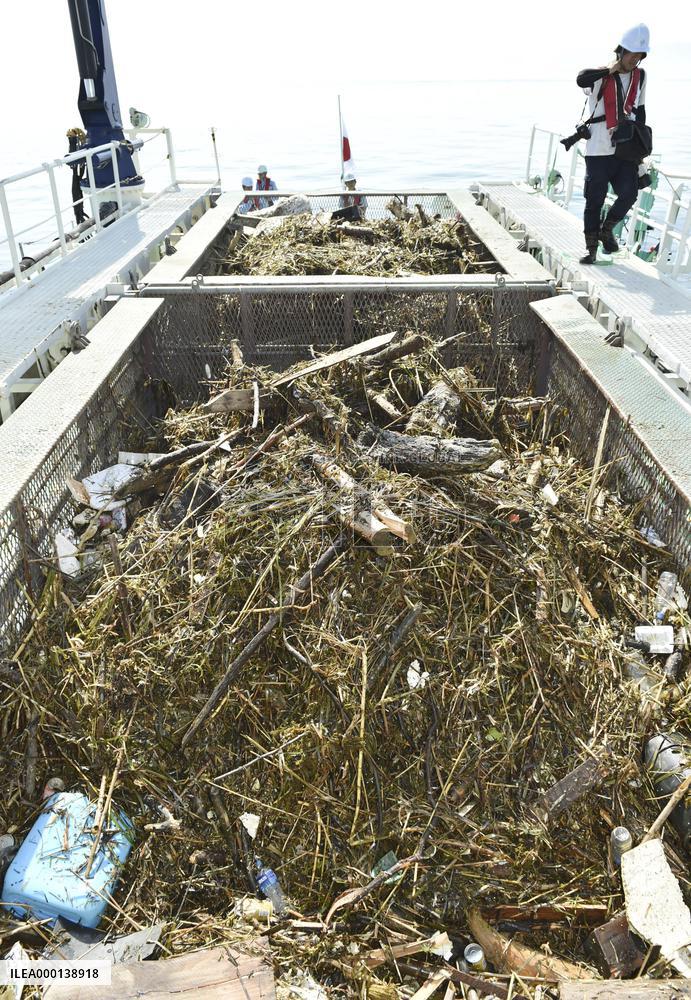 Marine debris widespread after flooding in western Japan