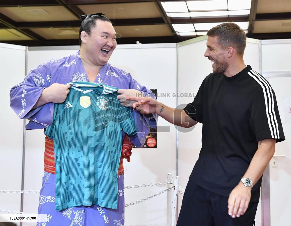 Yokozuna Hakuho and ex-Germany striker Podolski