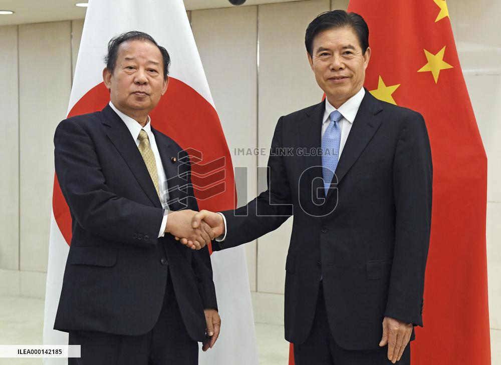 LDP Toshihiro Nikai and Chinese Commerce Minister Zhong Shan