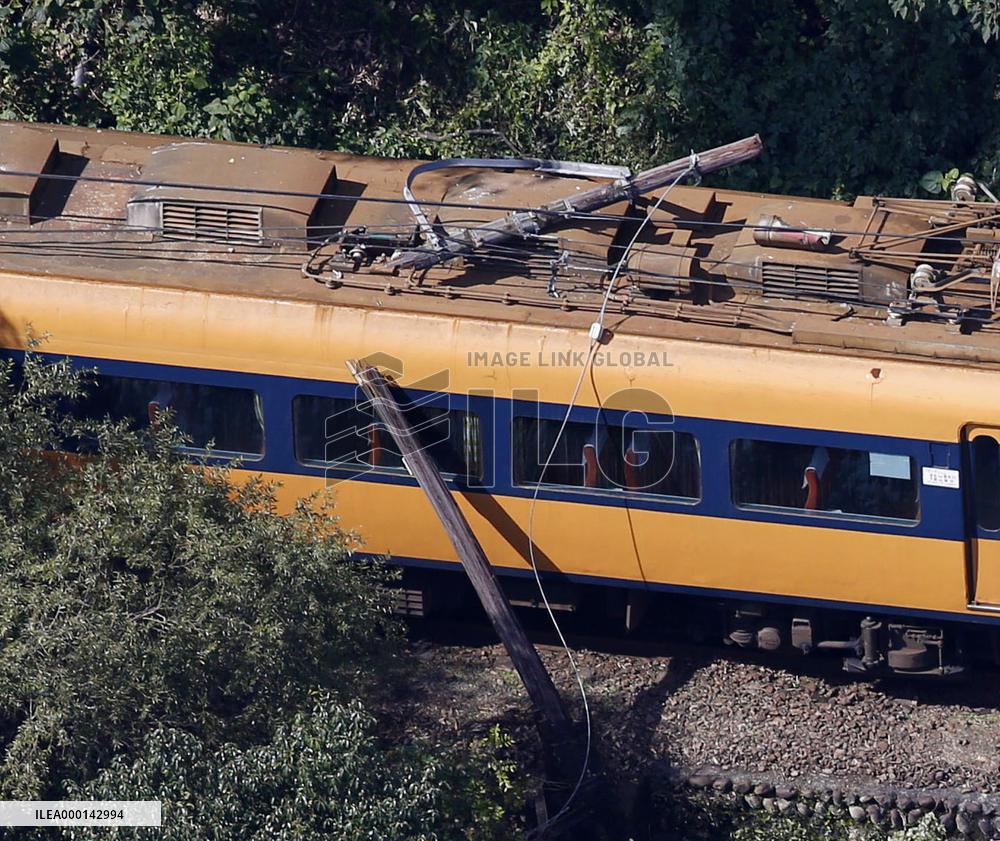 Train hits leaning utility pole in central Japan