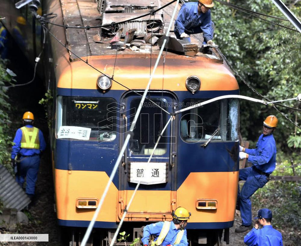 Train hits leaning utility pole in central Japan