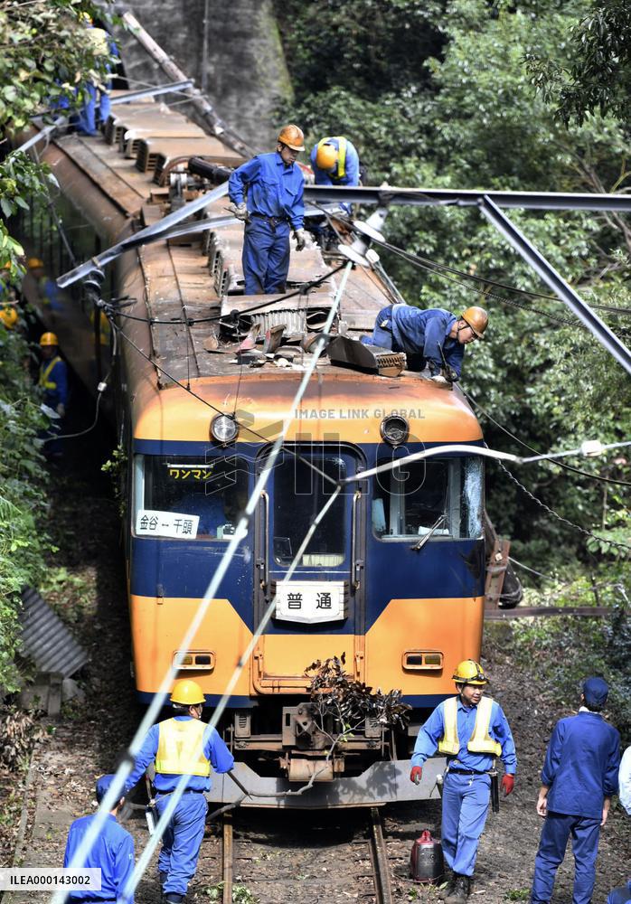 Train hits leaning utility pole in central Japan