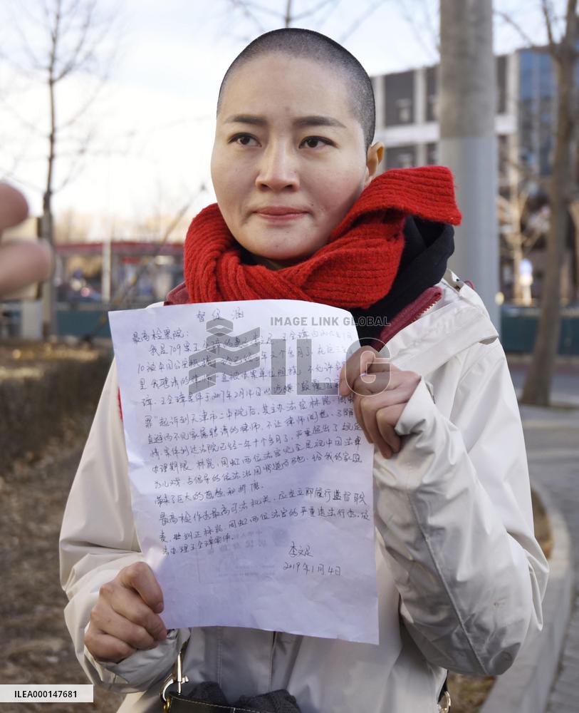 Wife of detained Chinese civil rights lawyer Wang