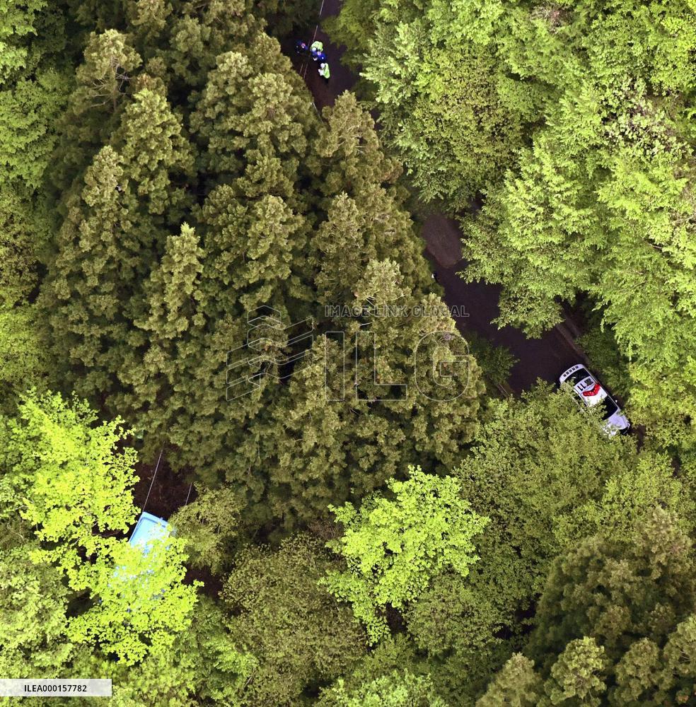 Minibus slides down mountain slope in Japan