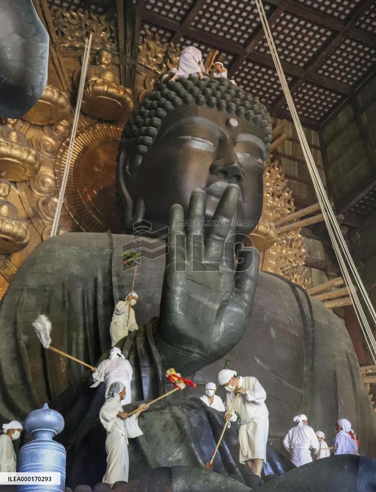 Annual cleaning of Great Buddha of Nara