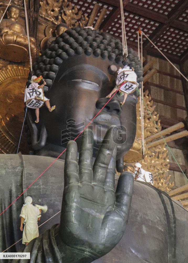 Annual cleaning of Great Buddha of Nara