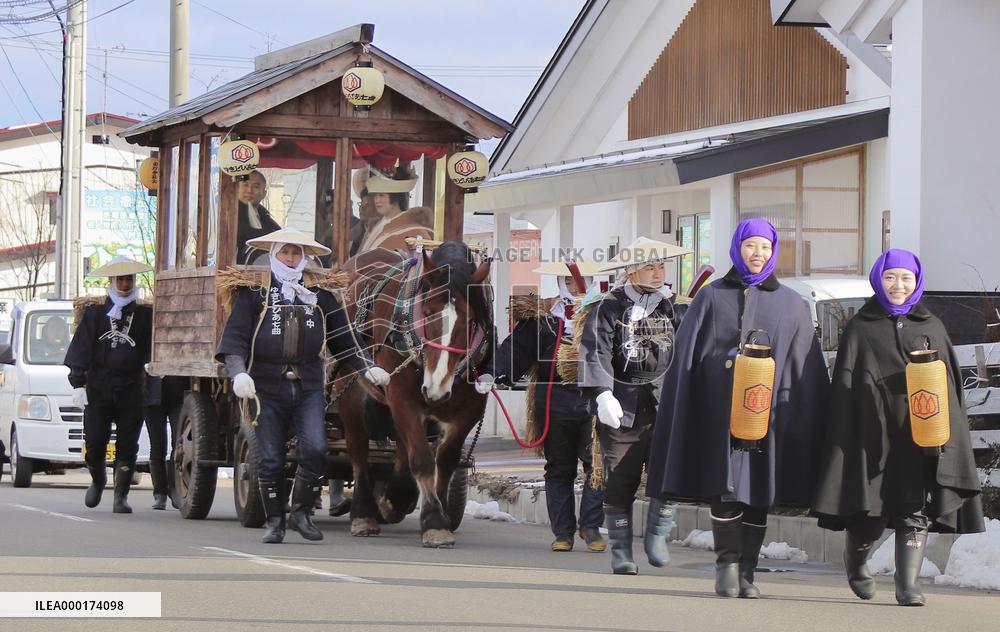 Snowy wedding parade in Japan