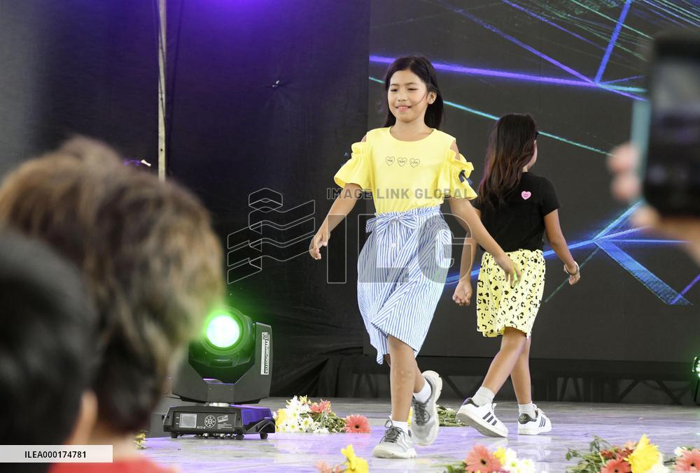 Fashion show by children in poverty