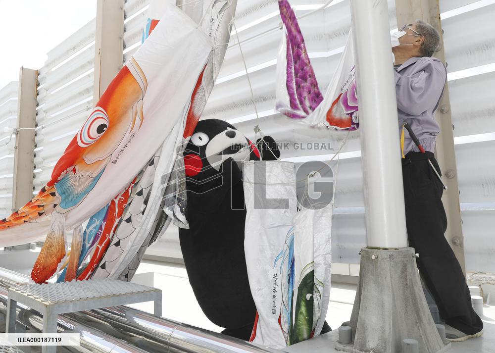 Kumamon mascot raises carp streamers