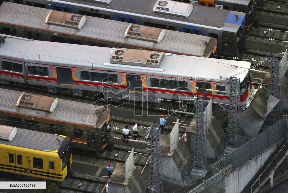 Derailed train at yard in western Japan