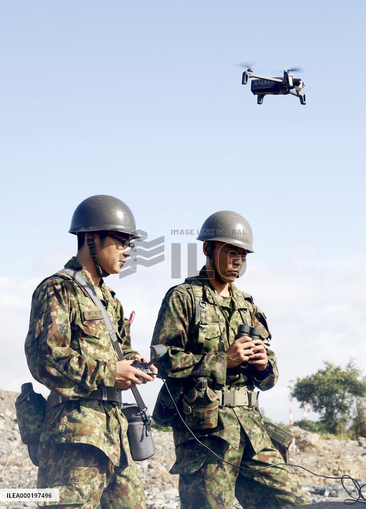 Search operations in flood-hit southwestern Japan