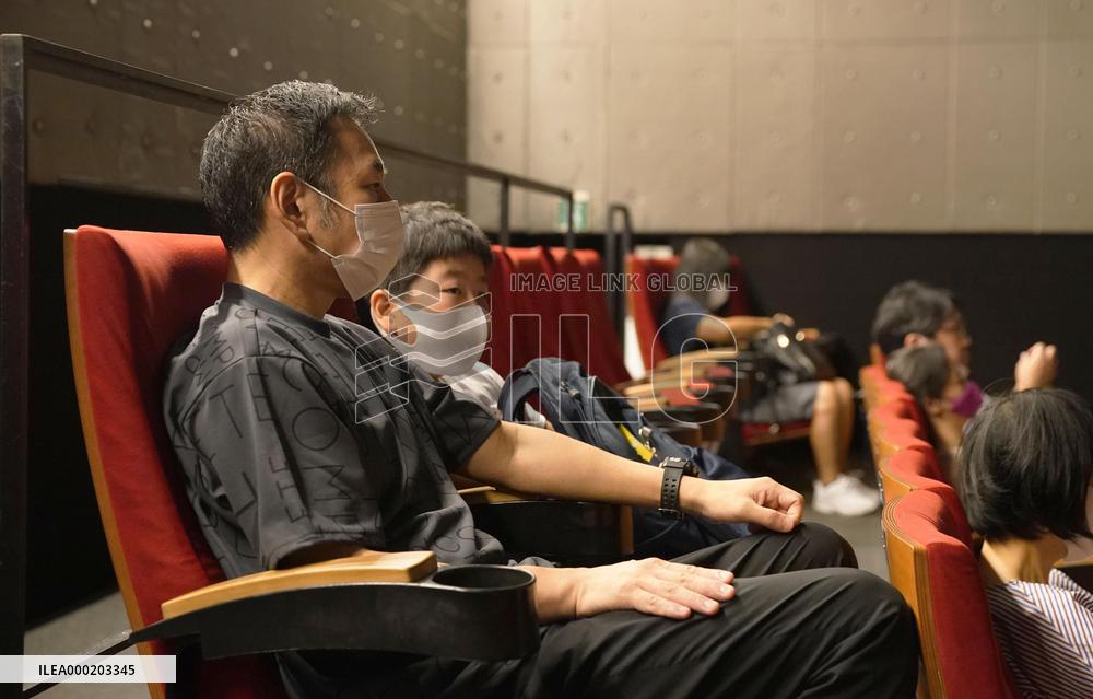 Japan eases virus rule to allow more people at sports, movie venues