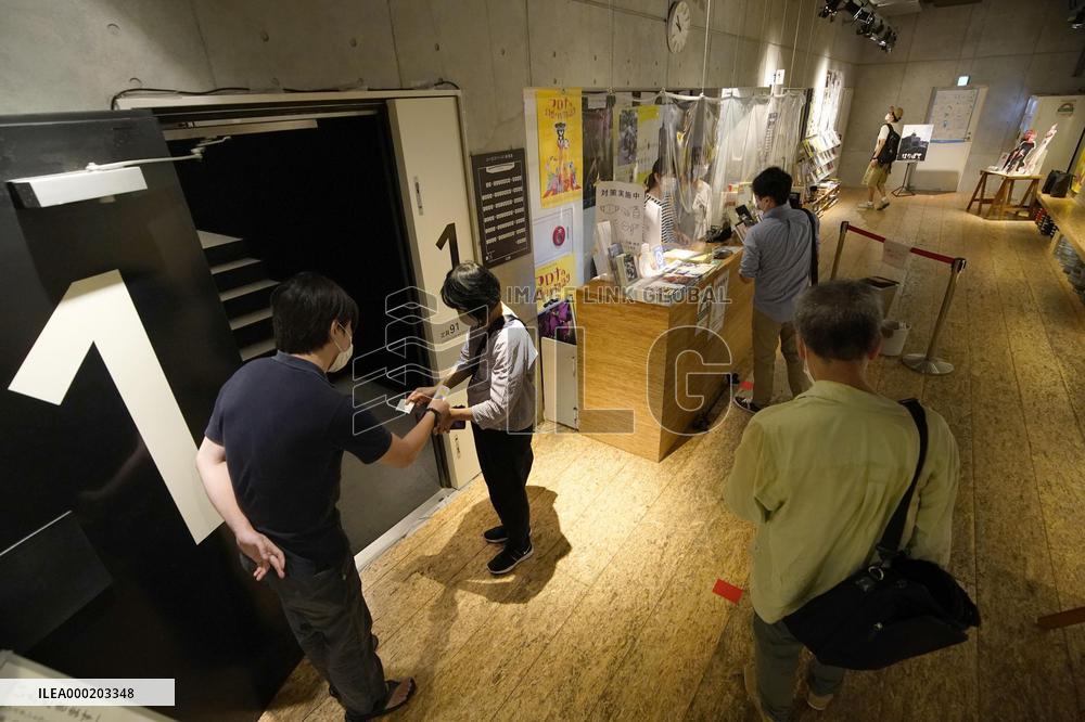 Japan eases virus rule to allow more people at sports, movie venues